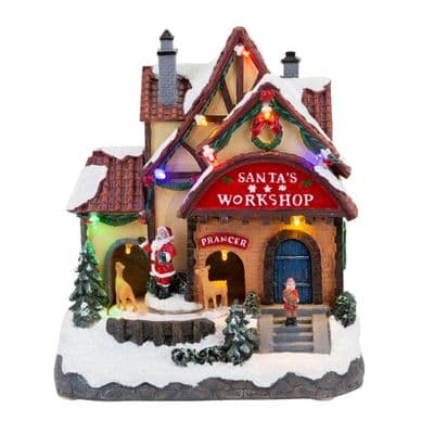 The Novelties Co. LED Light Up Musical Santa Workshop with Music and Lights 21CM