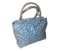 Daisies Pale Blue Wipe able Bag by Equilibrium