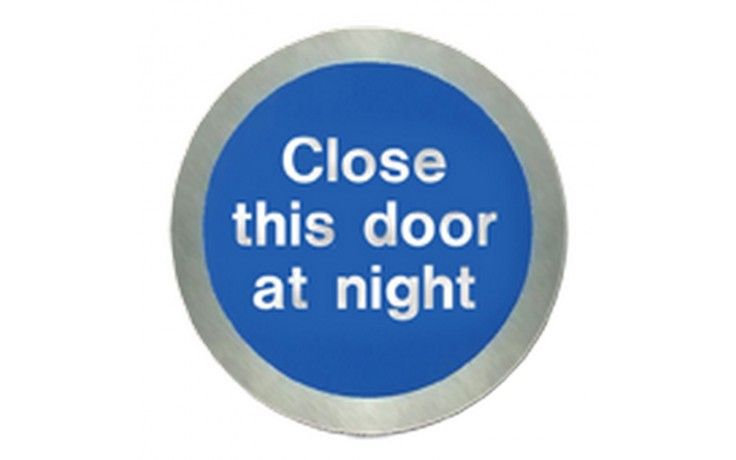 SS5123O - STAINLESS STEEL CLOSE THIS DOOR AT NIGHT DISC. Fire door sign