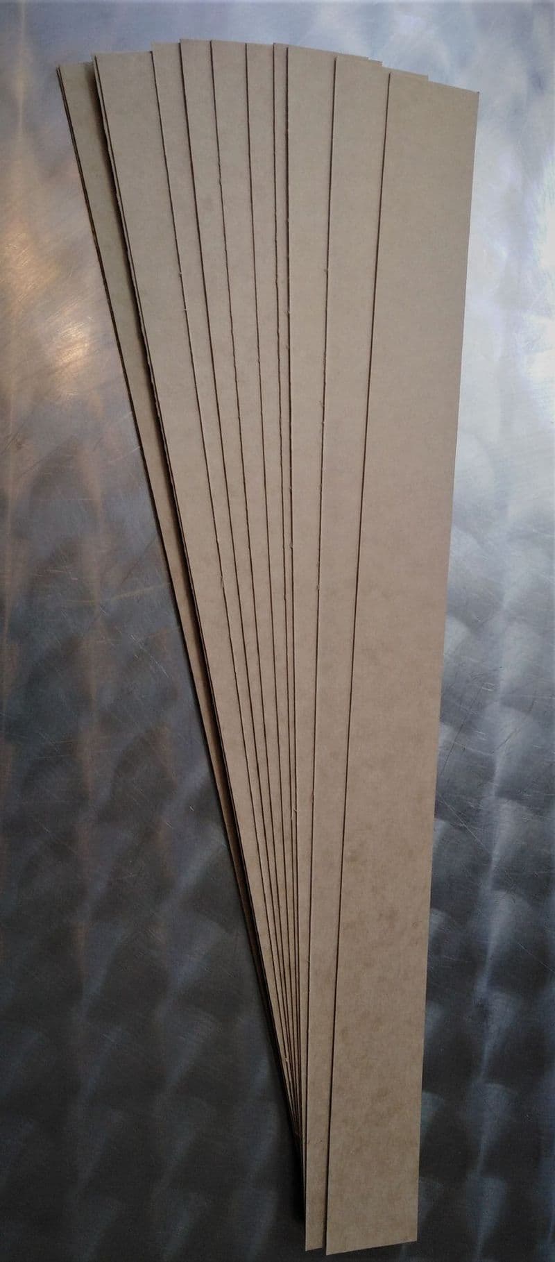 Cardboard strips for making various parts for mechanical musical instruments