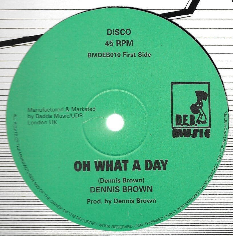 英12” Dennis Brown Oh What A Day / Man Next Door BMDEB010 D.E.B. Music /00250 Dennis Brown - Oh What A Day / Man Next Door DEB Music 12