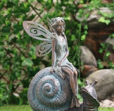 Bronze effect fairy on a Large Snail -.