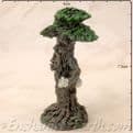 Enchanted Forest -  Green Tree Man Miniature - with scroll  on the  right.