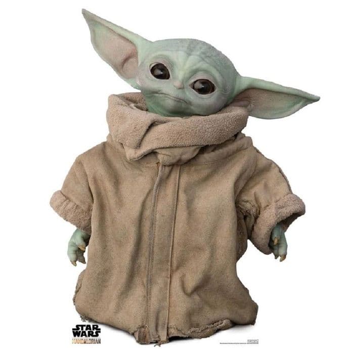 Mandalorian protects Grogu in Star Wars