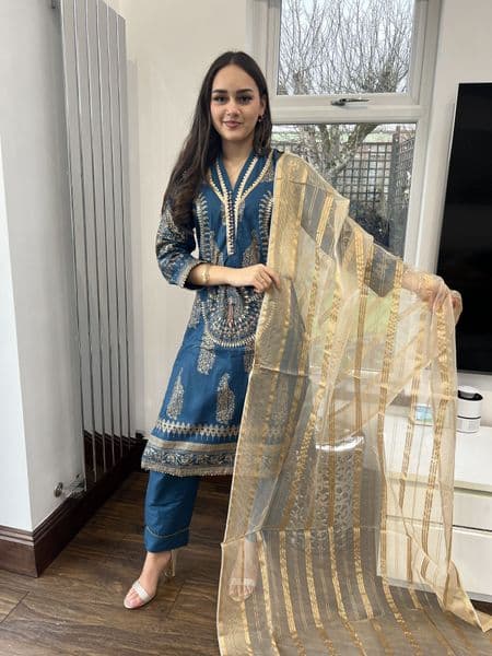 Hawa teal and gold outfit