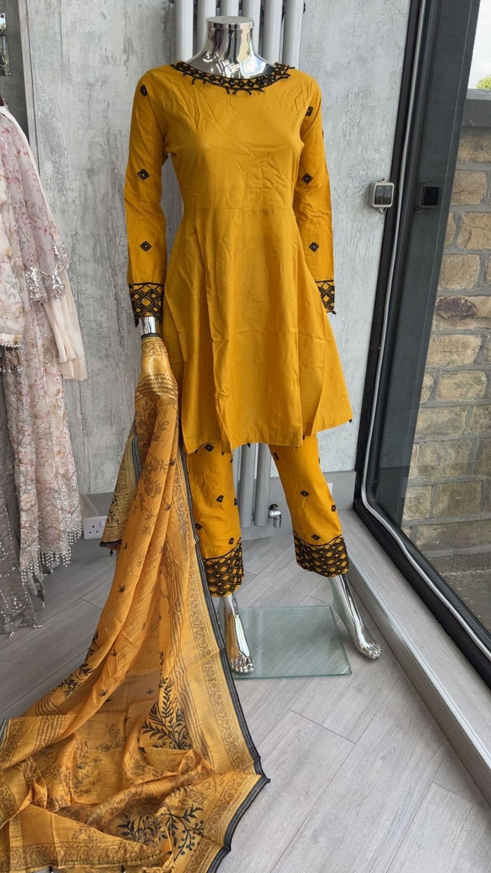 Yellow peplum style dress