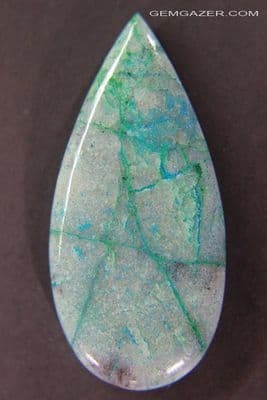 Ajoite in Quartzite cabochon, Arizona, USA. 41.77 carats.
