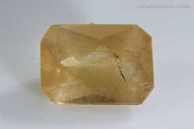 Albite Feldspar (Plagioclase) with Astrophyllite, faceted, Pakistan. 1.24 carats.