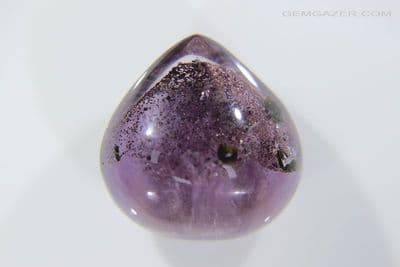 Amethyst cabochon with Goethite and Epidote phantom, Madagascar. 22.97 carats.