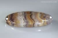 Banded Amethyst in Agate cabochon, Switzerland. 25.22 carats.