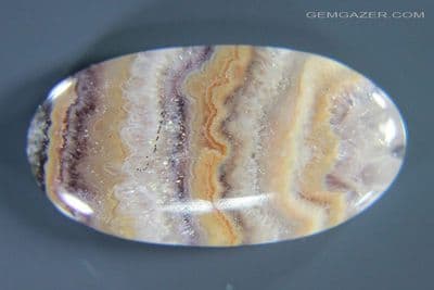 Banded Amethyst in Agate cabochon, Switzerland. 25.22 carats.