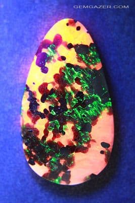 Calcite, Zincite & Willemite fluorescent cabochon, New Jersey USA. 21.68 carats.  ** SOLD **