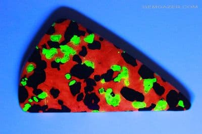 Calcite, Zincite & Willemite fluorescent cabochon, New Jersey USA. 38.12 carats.