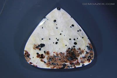 Calcite, Zincite & Willemite fluorescent cabochon, New Jersey USA. 62.29 carats.