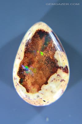 Cantera Fire Opal in matrix cabochon, Mexico. 7.43 carats.