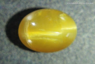 Cat's-Eye Fire Opal cabochon, Tanzania. 6.92 carats. (Video)  ** SOLD **