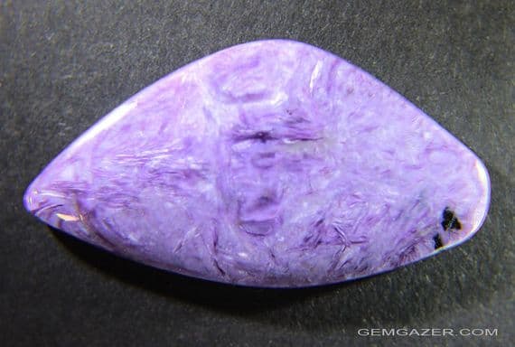Charoite cabochon.  59.57 carats.