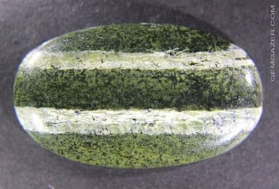 Chatoyant green Opal cabochon, Brazil.  63.00 carats.