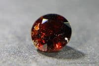 Chondrodite, dark red faceted, Pakistan.  0.82 carat.