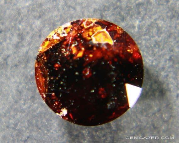 Chondrodite, dark red faceted, Pakistan.  0.82 carat.