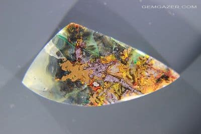 Chrysocolla & Native Copper in Chalcedony cabochon, Indonesia. 33.99 carats. (Video)
