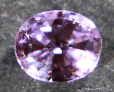 Colour-change Sapphire, pink - mauve faceted, Ceylon.  0.45 carat.