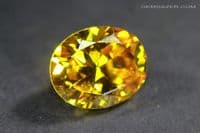 Cubic Zirconia (CZ), orange-yellow faceted. 4.68 carats.