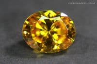 Cubic Zirconia (CZ), orange-yellow faceted. 4.68 carats.