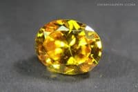 Cubic Zirconia (CZ), orange-yellow faceted. 4.68 carats.