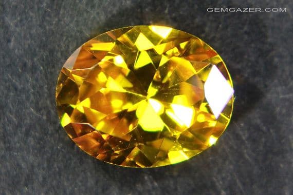 Cubic Zirconia (CZ), orange-yellow faceted. 4.68 carats.