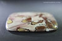 Dendritic Flower Rhyolite cabochon, China.  136.98 carats