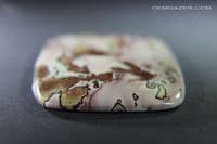 Dendritic Flower Rhyolite cabochon, China.  136.98 carats