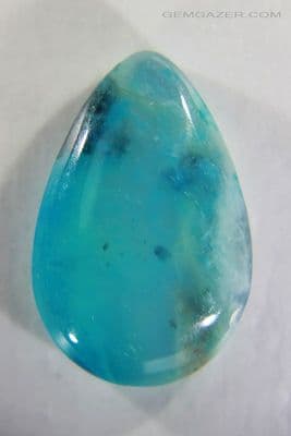 Dendritic paraiba-blue Opal cabochon, Peru. 8.43 carats.