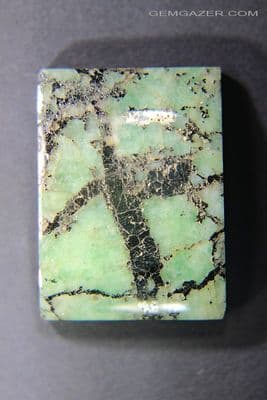 Emerald cabochon with Pyrite seam, Colombia. 38.06 carats (Video).