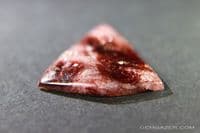 Eudialyte cabochon, Canada.  17.07 carats.