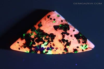 Fluorescent Calcite, Zincite, Franklinite & Willemite cabochon, USA. 88.53 carats.