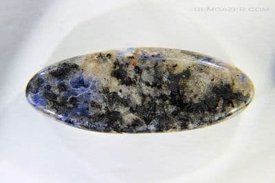 Fluorescent Sodalite cabochon, Canada. 109.38 carats.