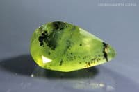 Green dendritic Opal, faceted, Peru.  1.84 carats.