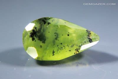 Green dendritic Opal, faceted, Peru.  1.84 carats.