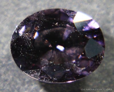 Greyish-purple Sapphire, faceted, Madasgacar.  0.98 carat.