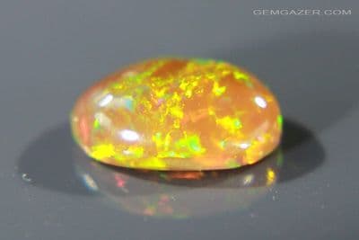 Honey-Mustard colour Precious Opal cabochon, Ethiopia. 4.01 carats. (Video)
