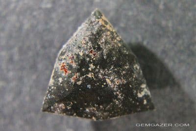 Impactite, faceted, Morocco.  6.42 carats.