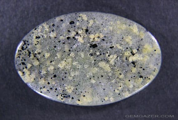 Narsarsukite in Quartz cabochon.  22.96 carats.