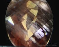 Oligoclase red copper Sunstone with schiller, faceted, Dust Devil mine, Oregon, USA.  0.72 carat.