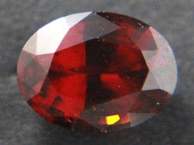 Orange-red Grossular Garnet, faceted, Sri Lanka.  2.25 carats.