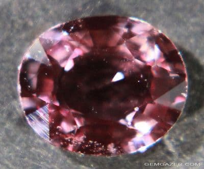Pinkish-maroon Sapphire, faceted, Madagascar.  1.21 carats.