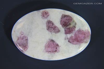 Pinkish-red Tourmaline in Quartzite cabochon, Brazil. 75.25 carats.
