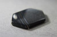 Psilomelane, black banded cabochon, Mexico.  35.03 carats.