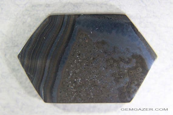 Psilomelane, black banded cabochon, Mexico.  35.03 carats.