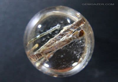 Quartz cabochon with Amphibole inclusions, China.  109.25 carats.